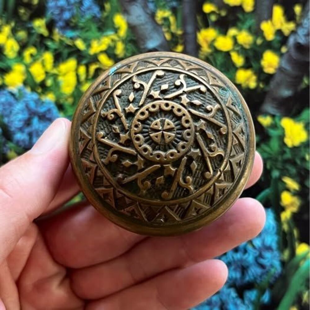 Pair of Vintage Brass Door Knobs with Intricate Detail